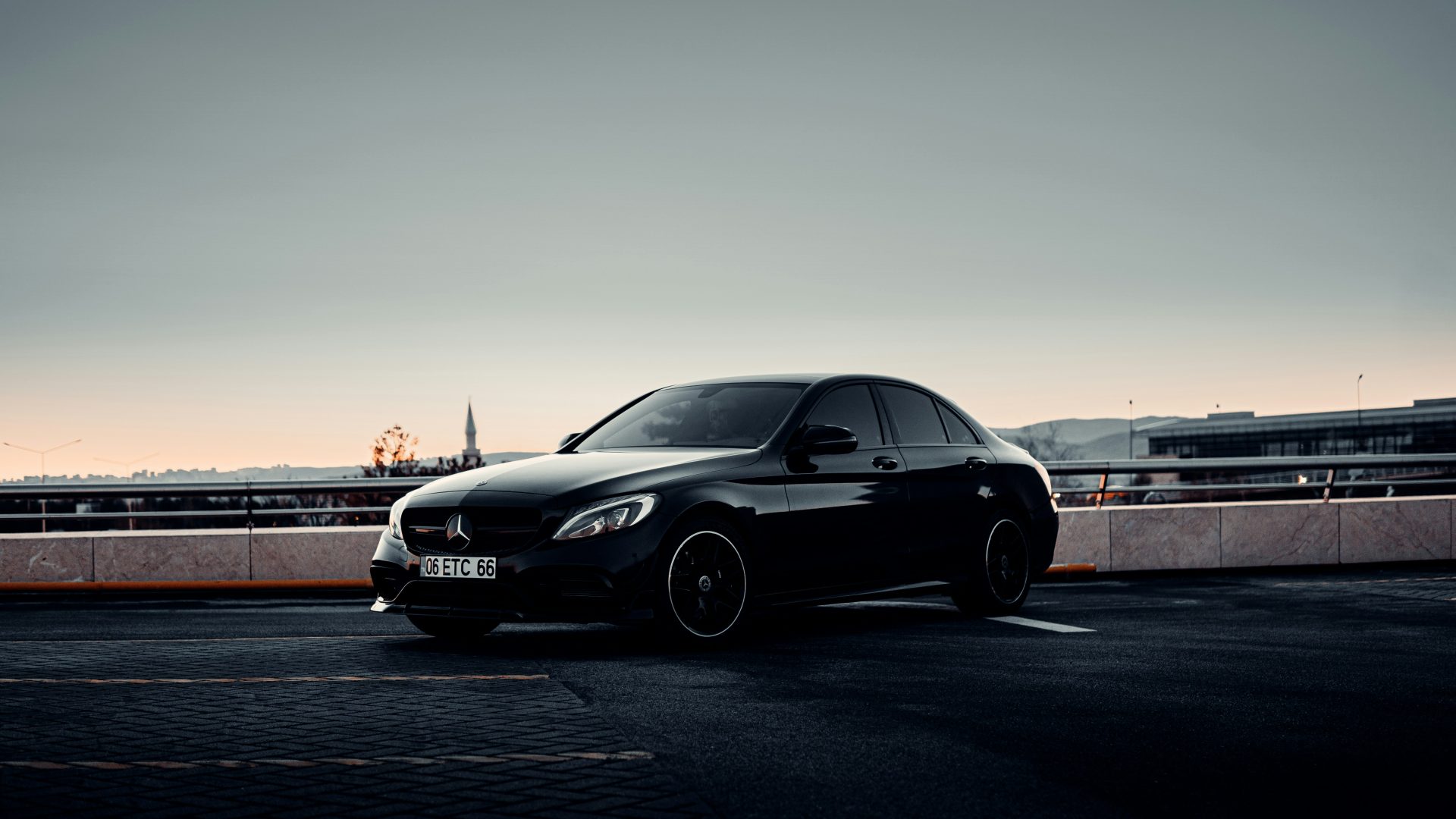 a black car parked in a parking lot